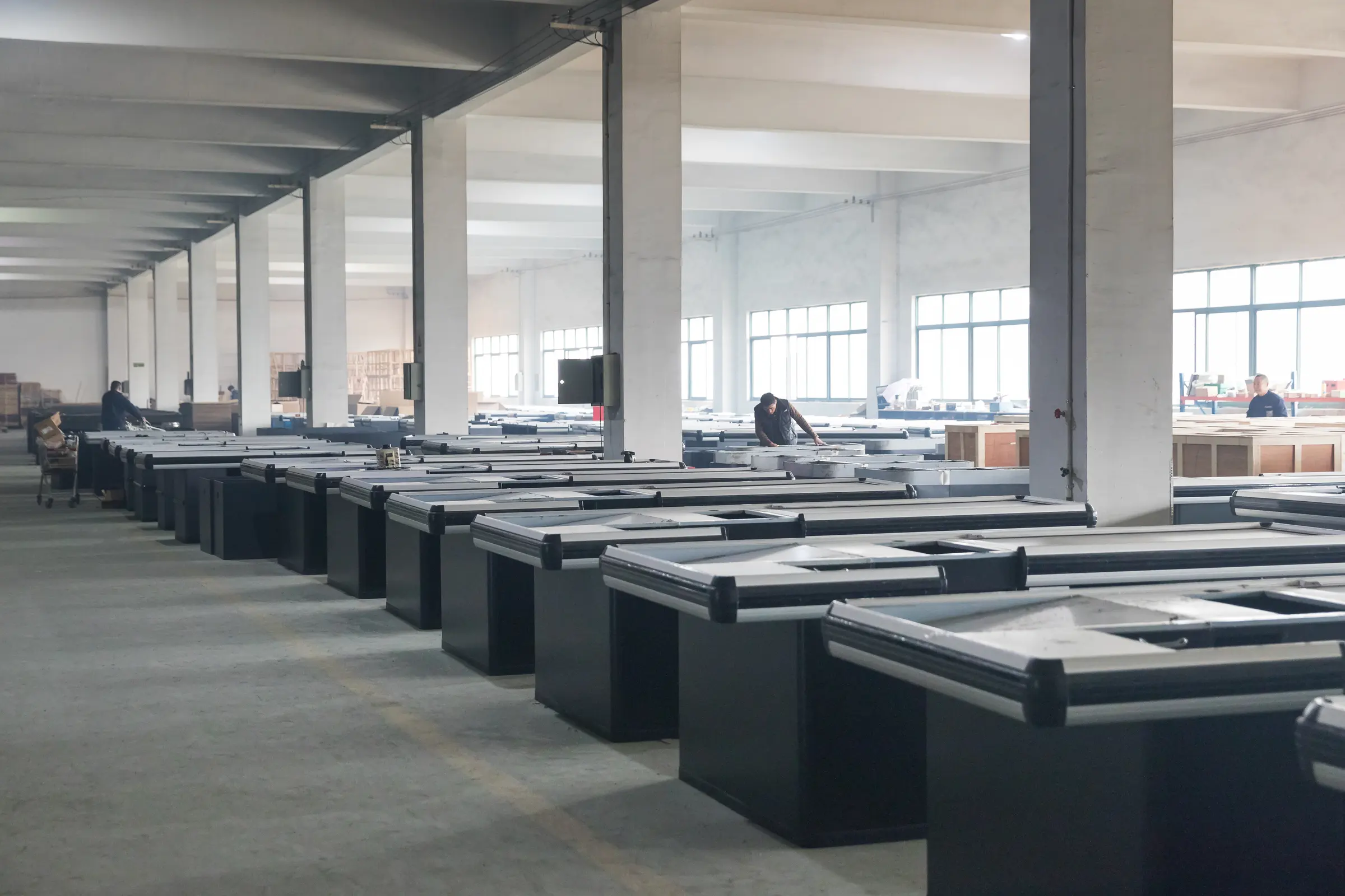 Rows of finished refrigerated cabinets staged in the Keshun workshop in Changshu