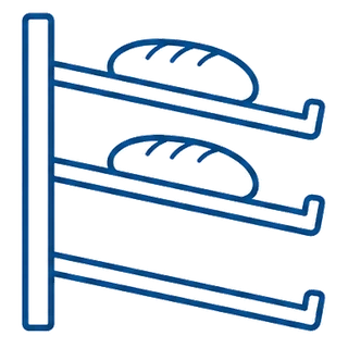 Bakery rack with three trays tilted forward and a front lip holding the loaves