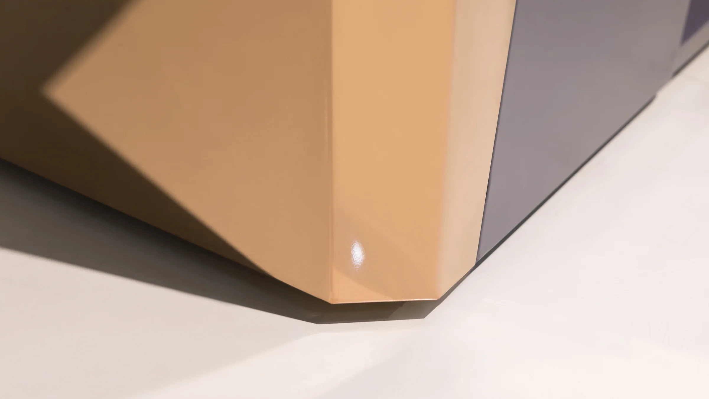Checkout counters with impulse tiers facing the queue side in the Keshun showroom