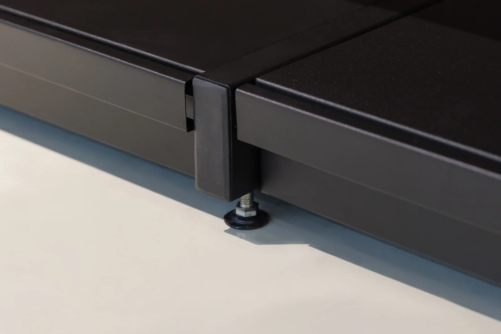 A run of steel and wood bays with categories grouped and the shelf pitch set per run