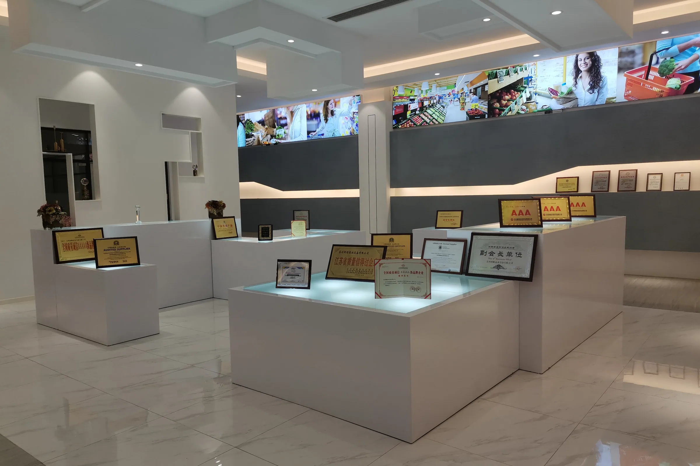 Glazed display cases and timber service counters on the Keshun showroom floor