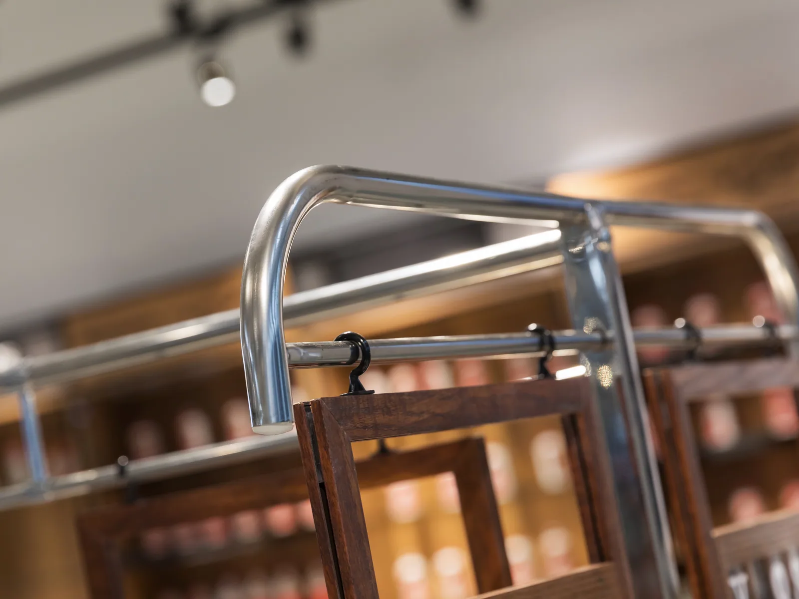 Close-up of the stainless deck and timber flank on a Keshun supermarket produce rack