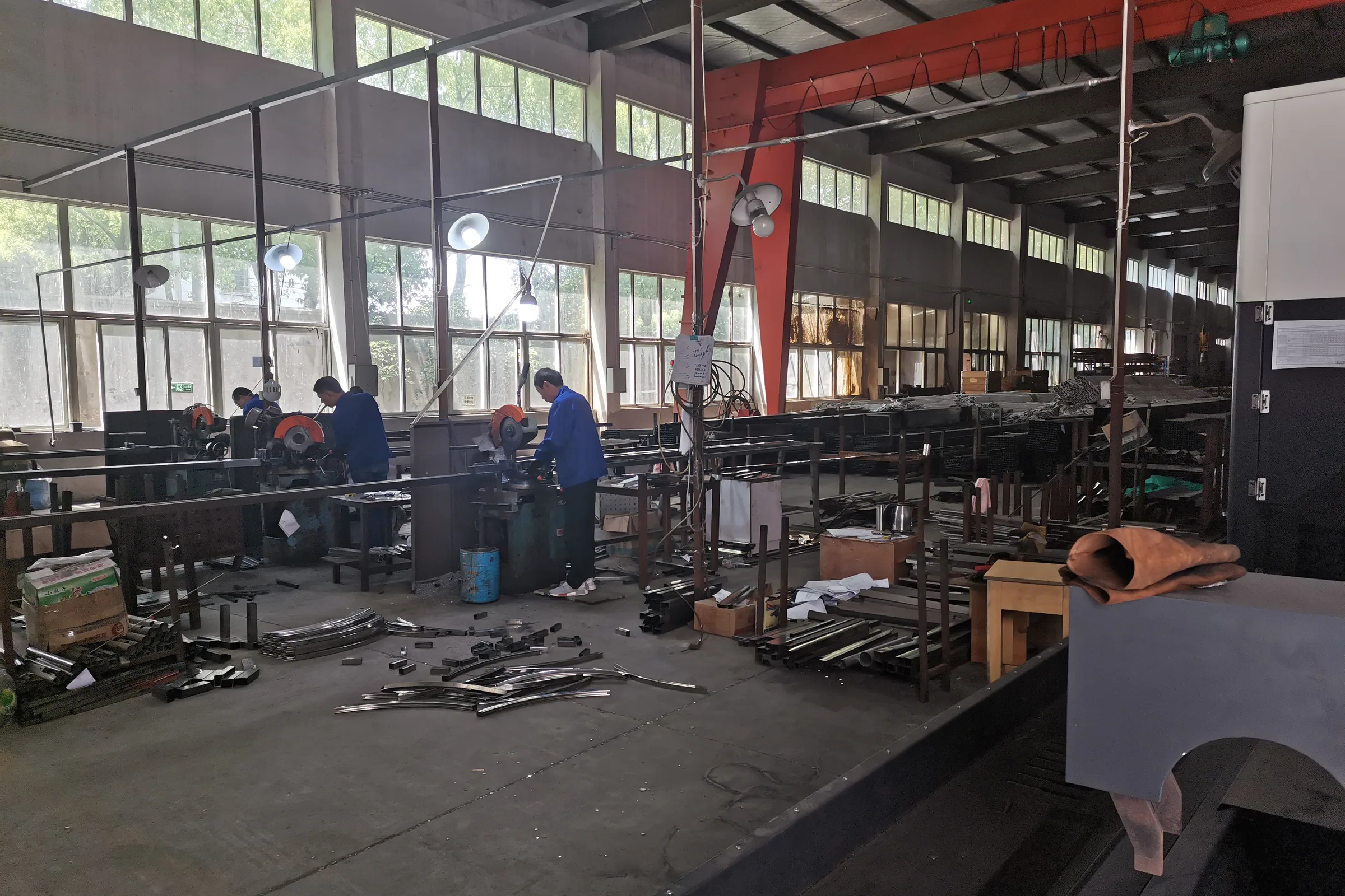 Steel frames for Keshun supermarket promotional display stands stacked in the production hall