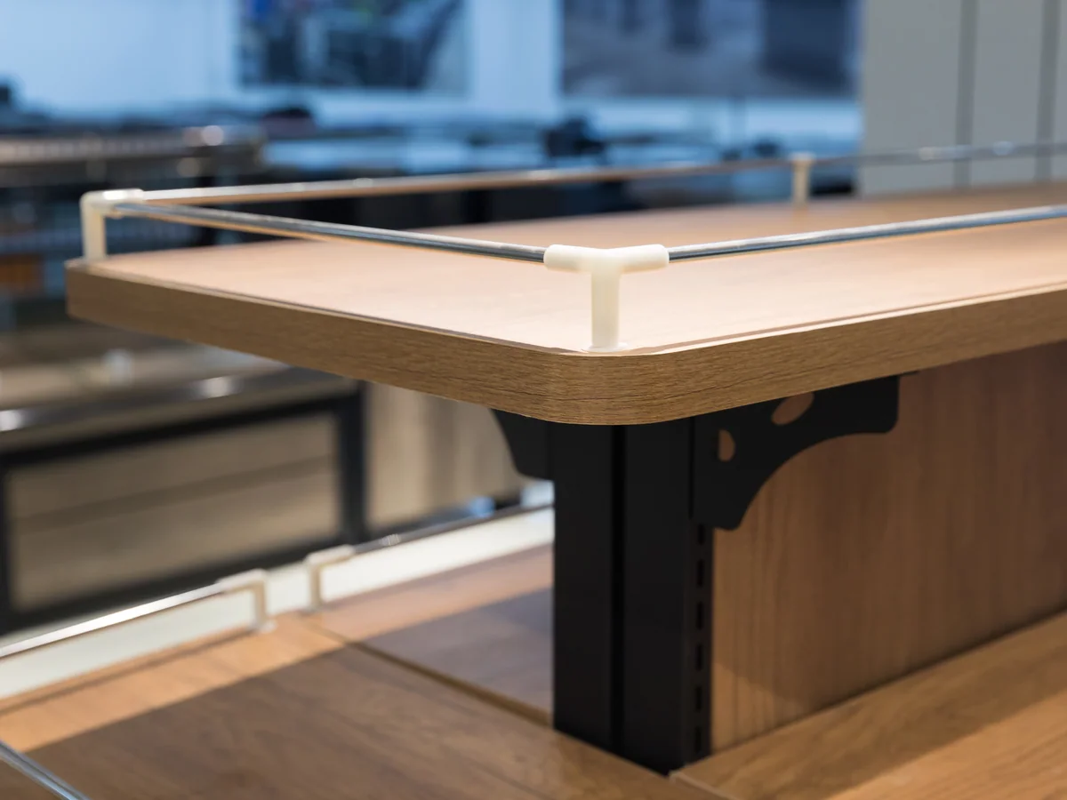 Close-up of the black cantilever bracket carrying the raised deck off the carcase