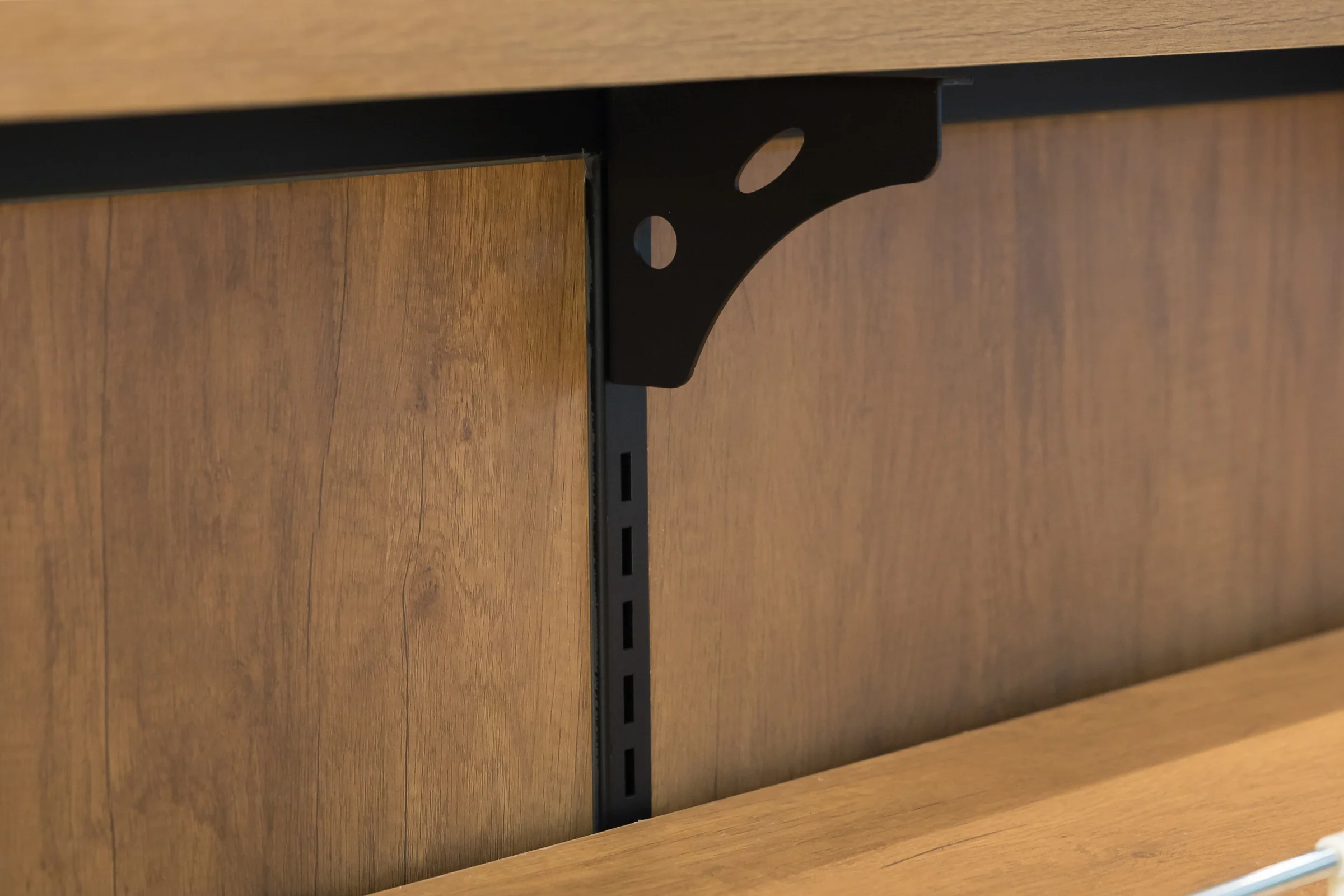 Keshun two level dry goods island with glass panels in a black steel rail over a timber base