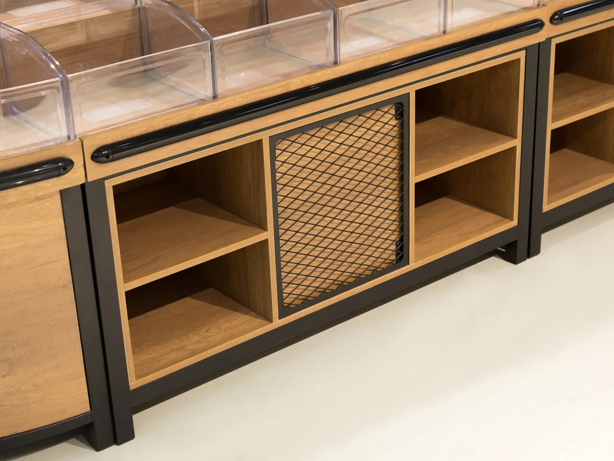 Close-up of the open cubby shelves showing the perforated back panel behind them
