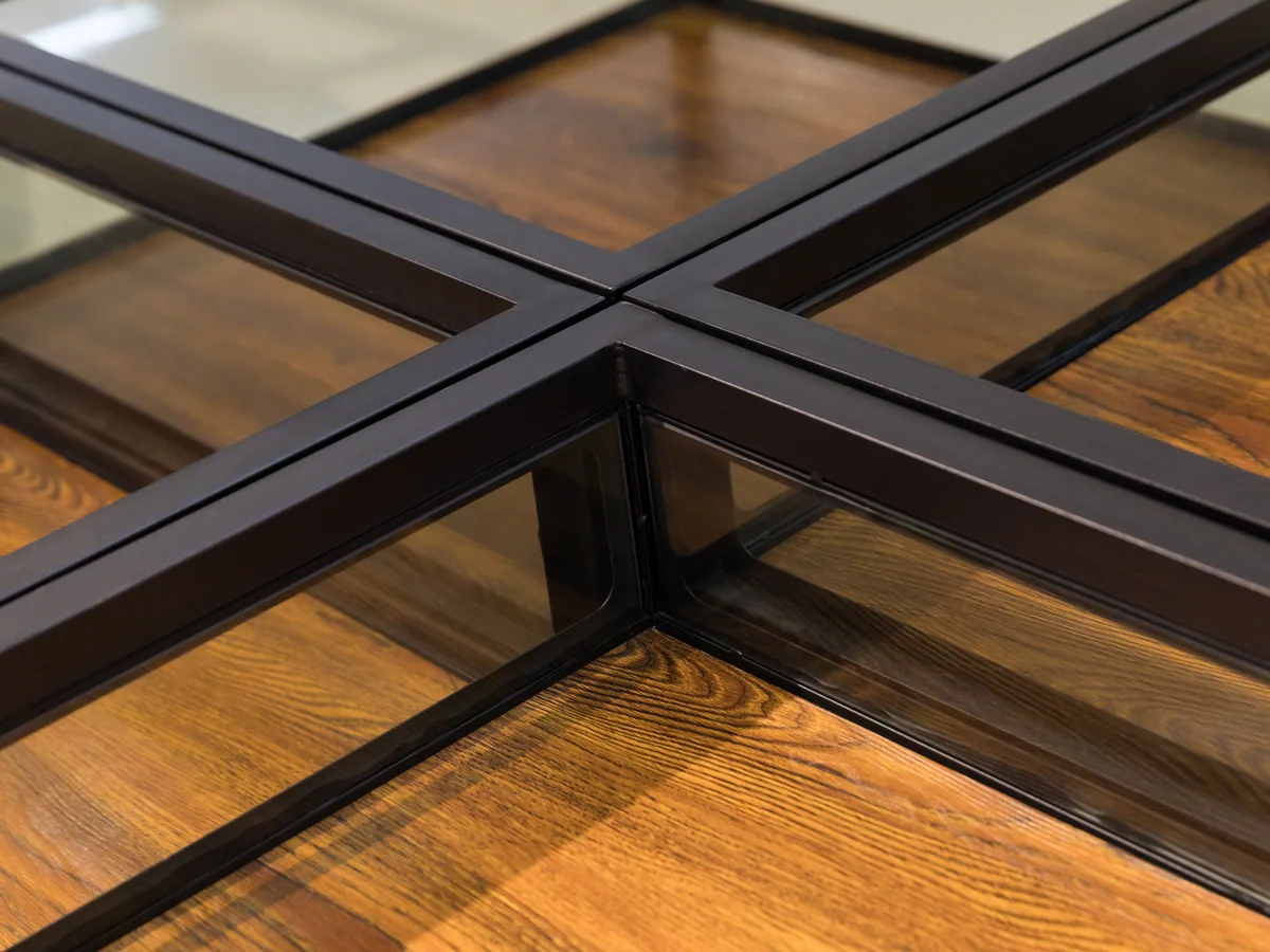 Close-up of the steel cross brace junction at the centre of the glazed top