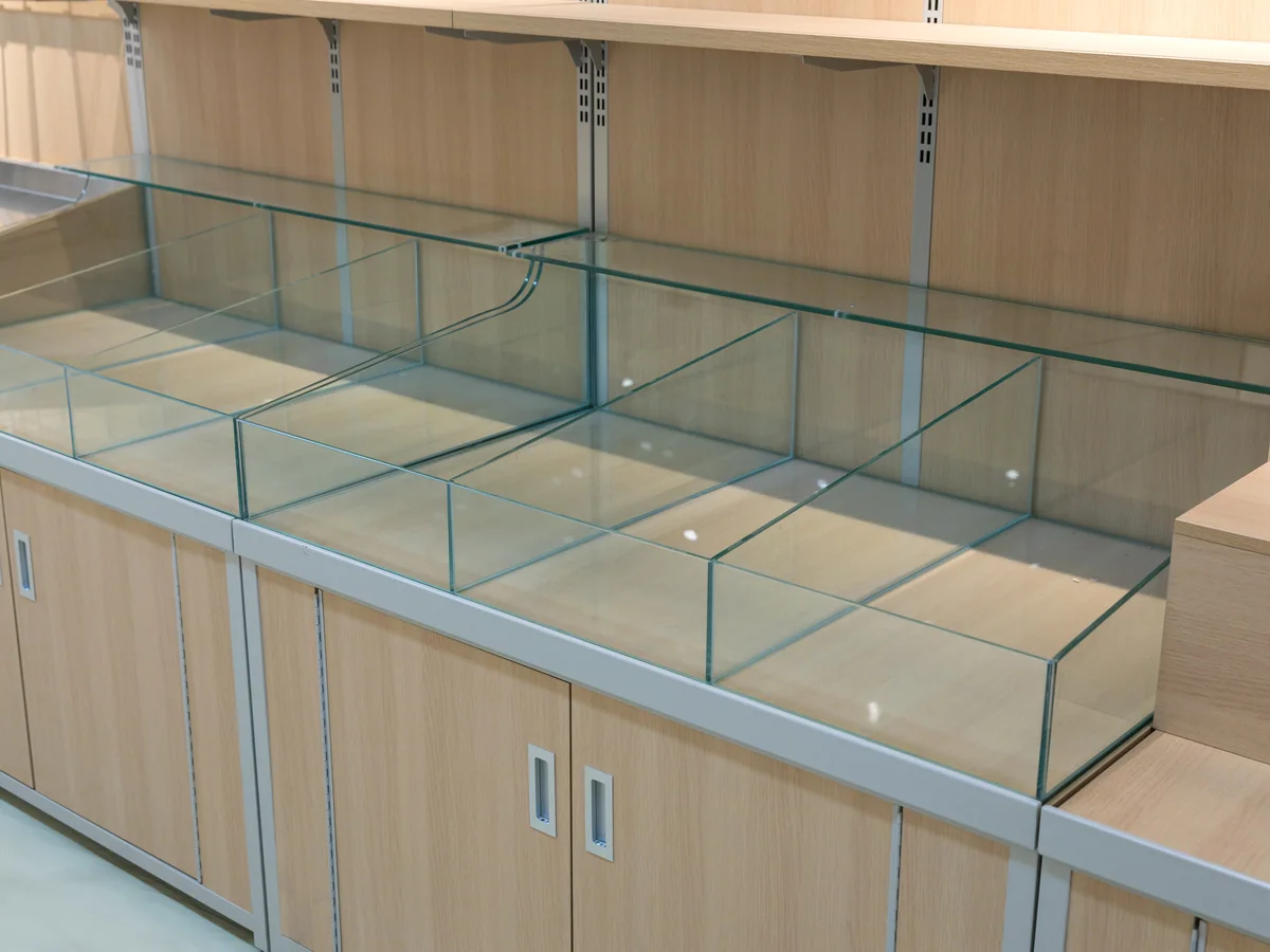 Close-up of the glazed bins sitting above the closed base cabinets