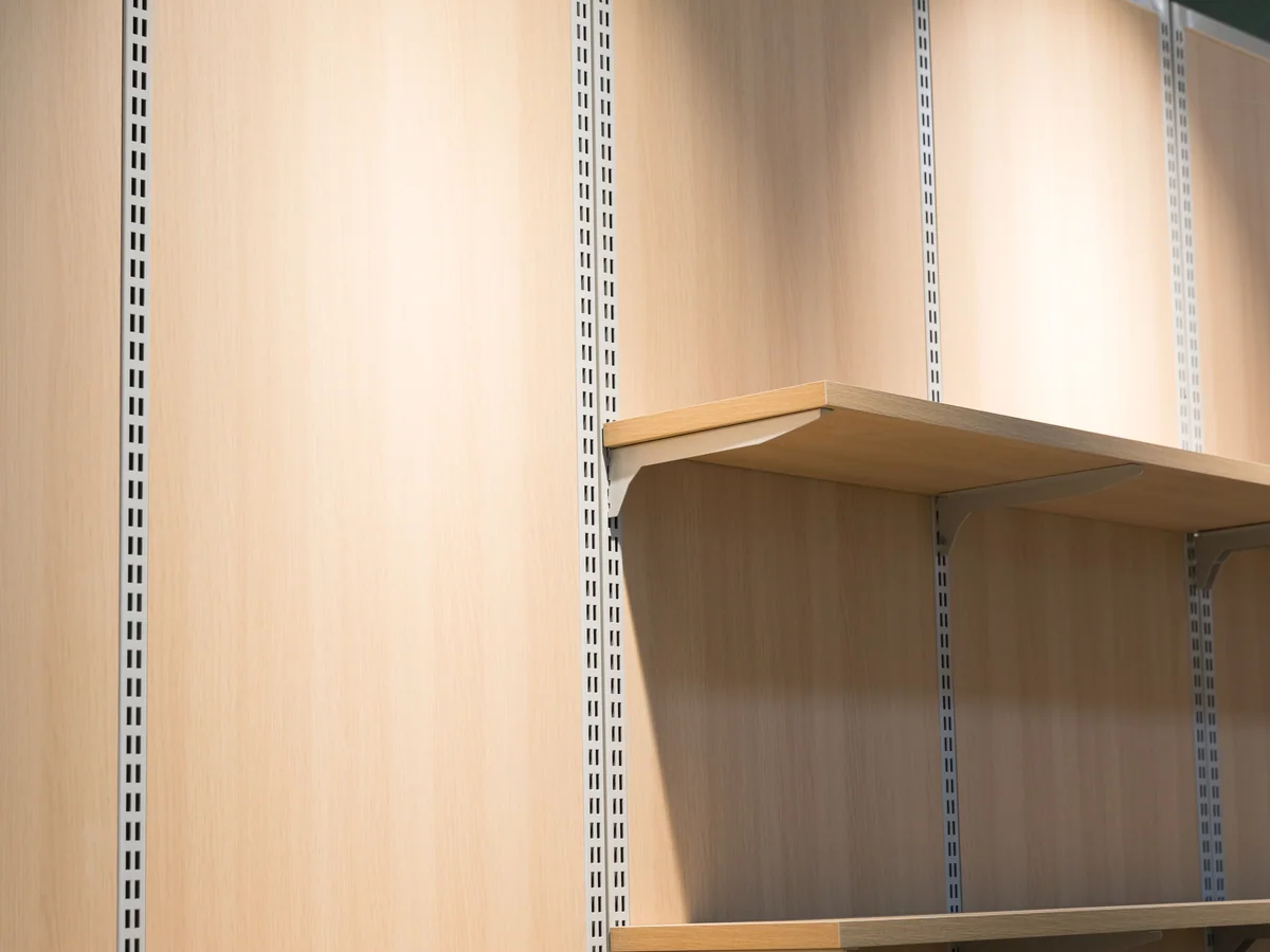 Close-up of the angled shelf fitted under the upper canopy of the wall unit