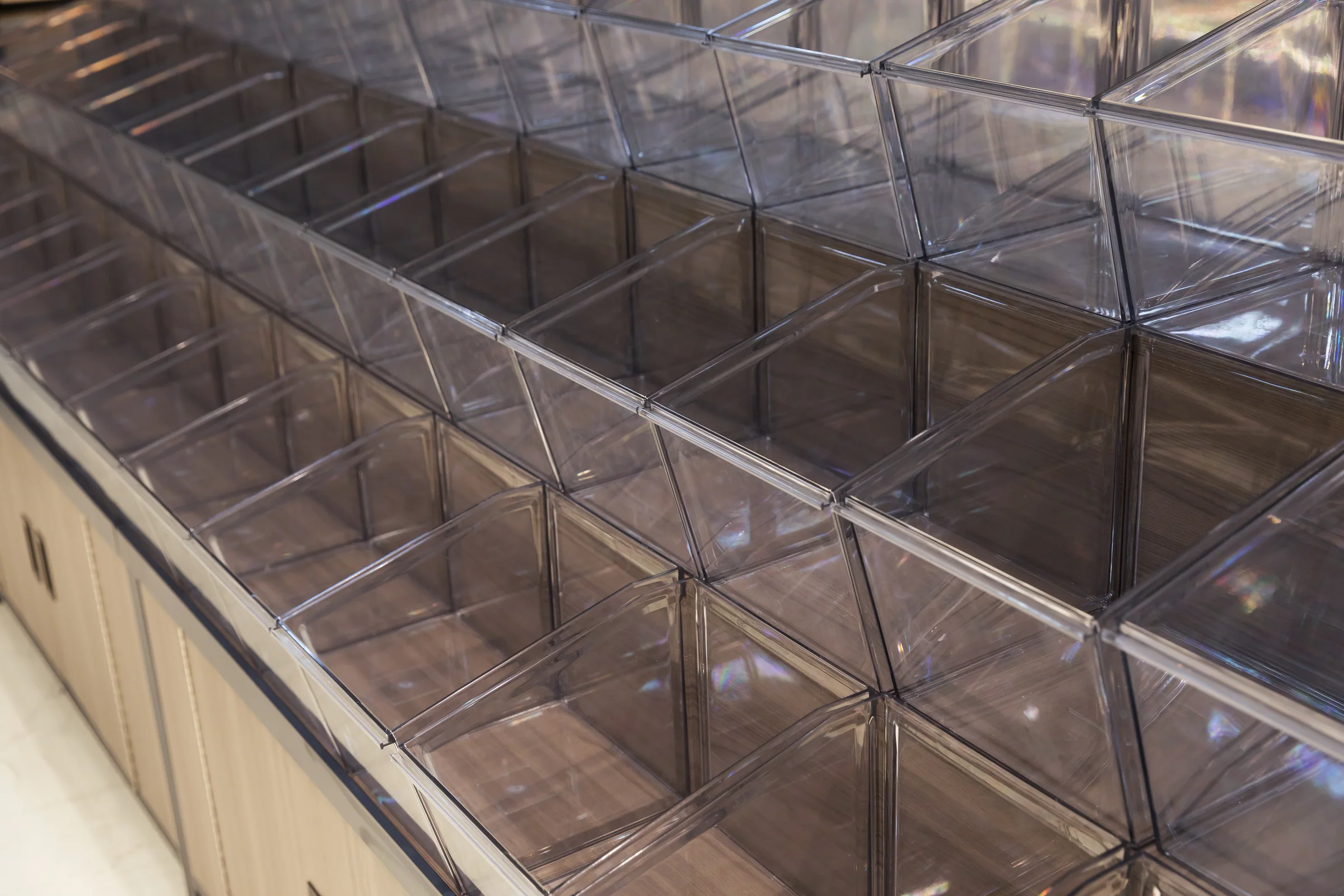 Keshun dark timber tilt bin island with a black steel frame and three rows of clear bins