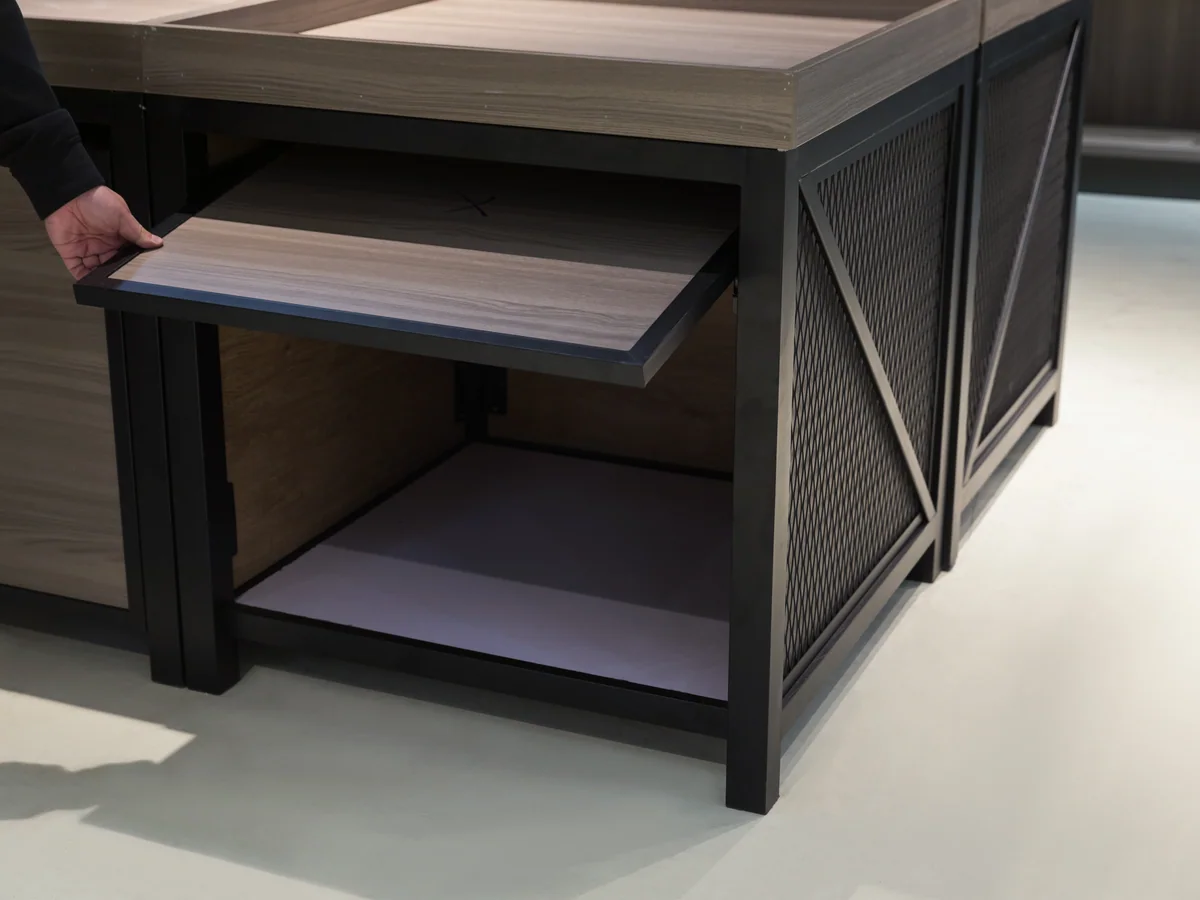 Close-up of a pull out tray part way out of the island cabinet