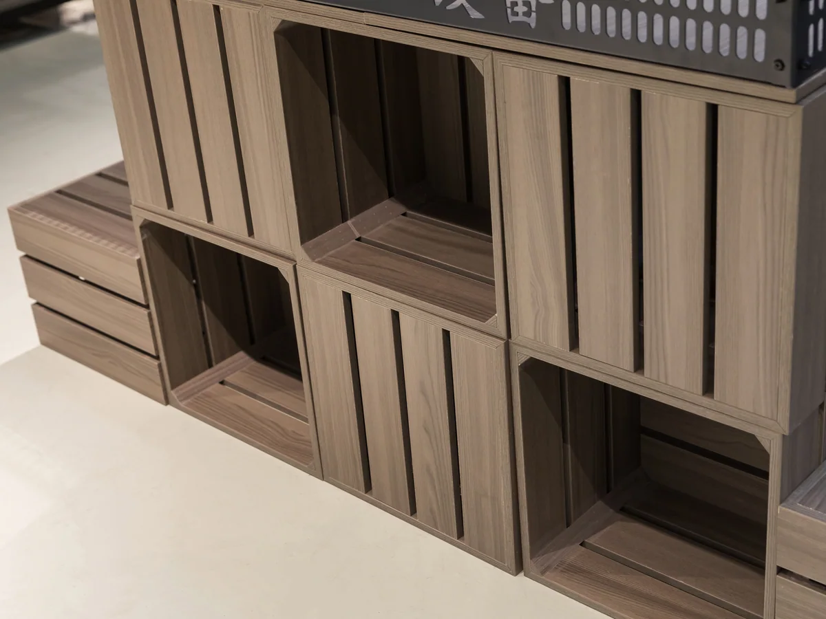 Close-up of crates stacked on the stepped platforms of the display