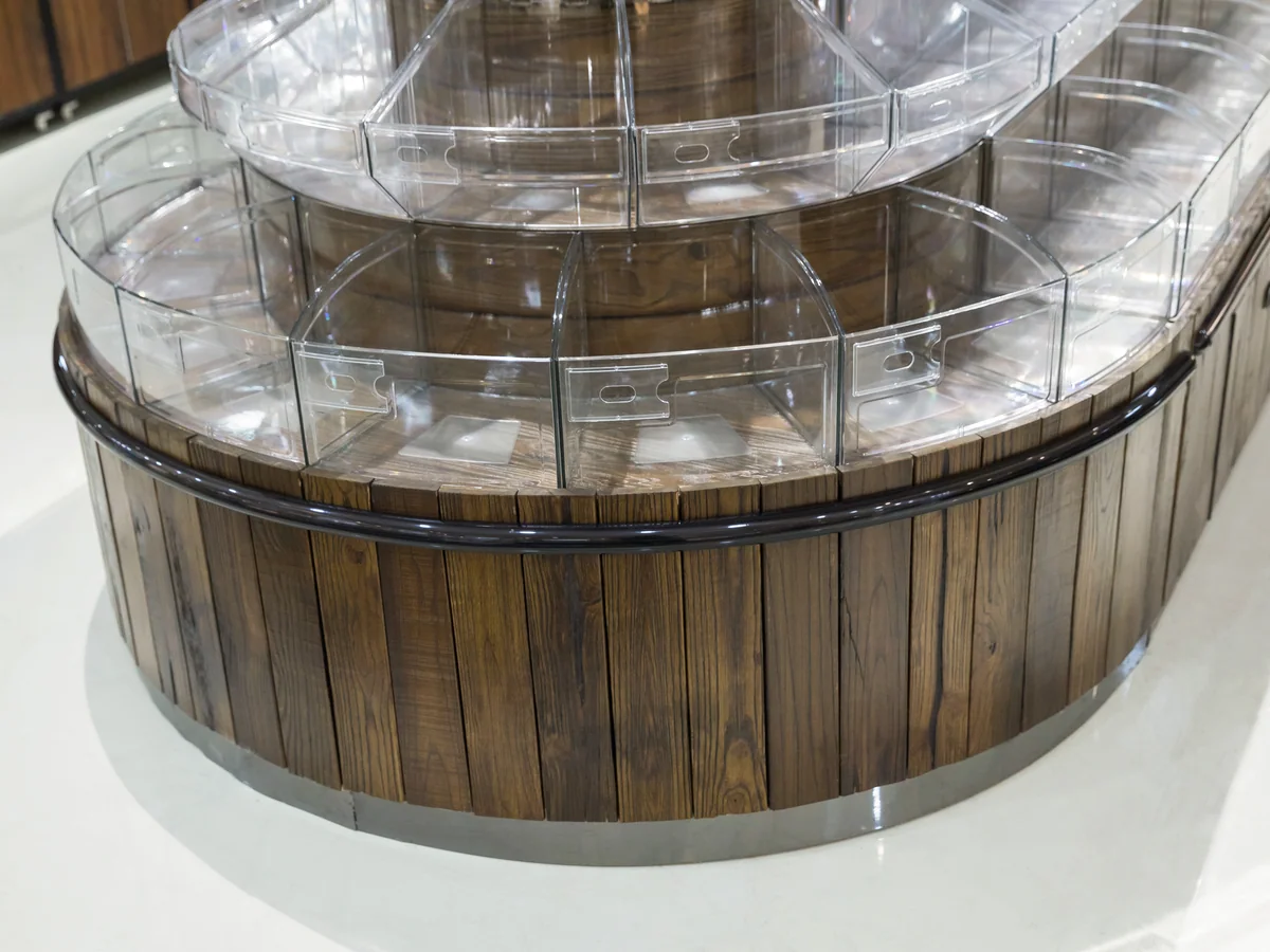 Close-up of the clear bins arranged in stepped rings around the tower