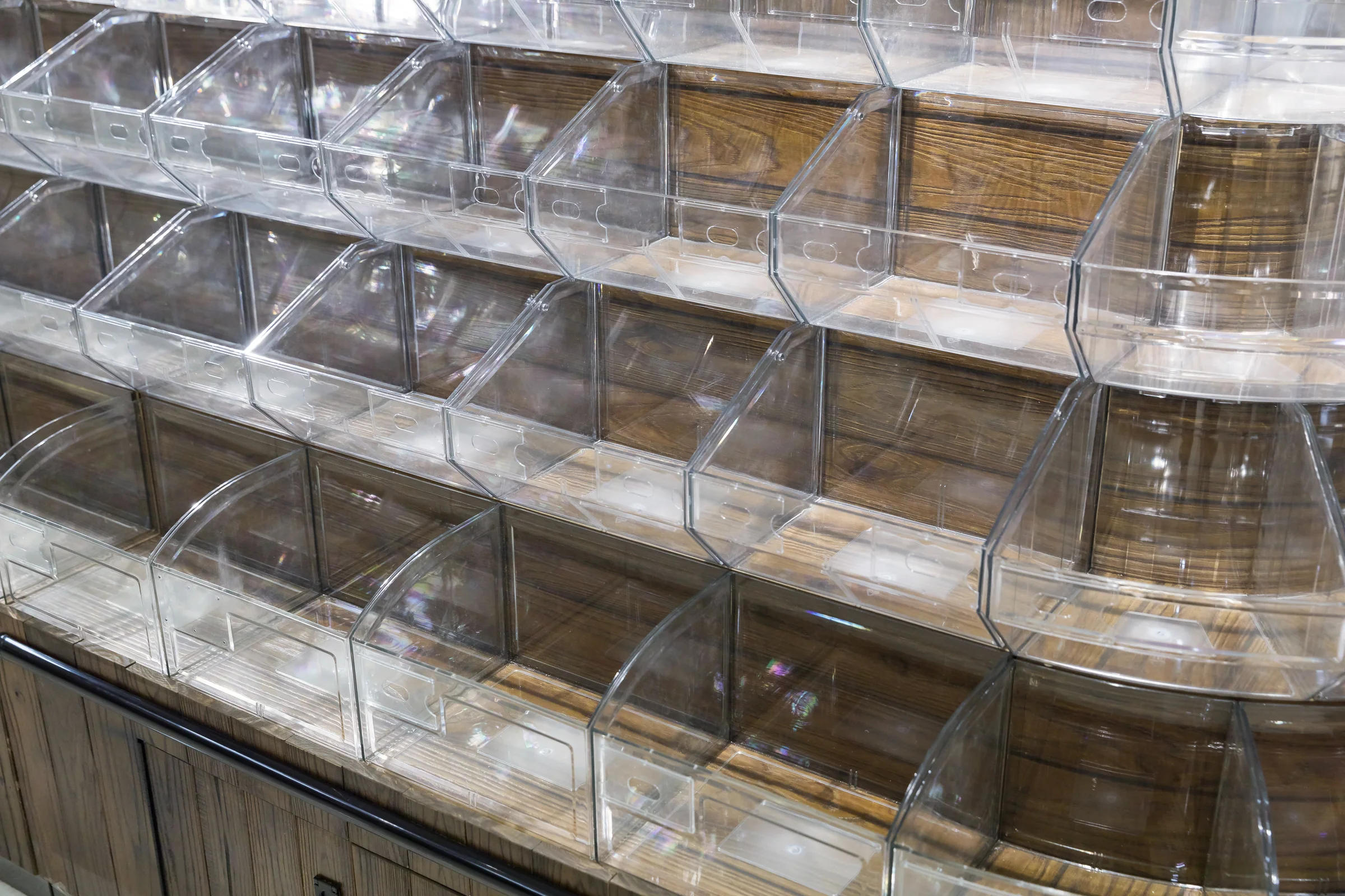 Keshun round tiered bin tower in staved dark timber with clear bins climbing in rings