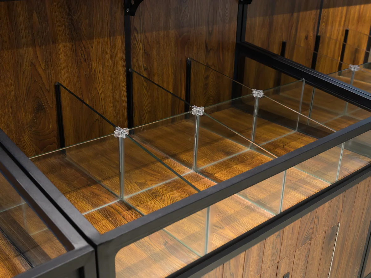 Close-up of the glazed display top with ticket clips fitted along the rail