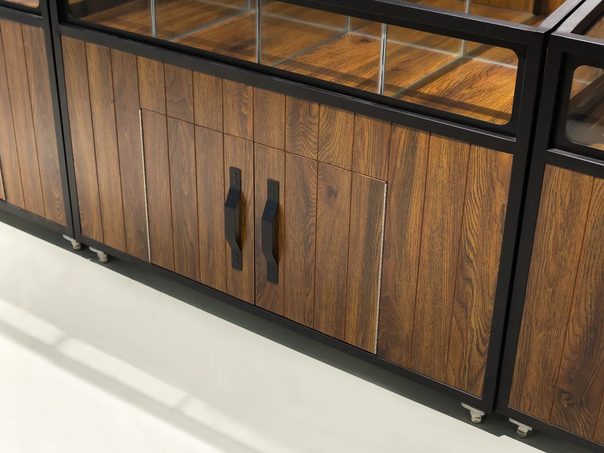 Close-up of the dark timber doors with long black bar handles