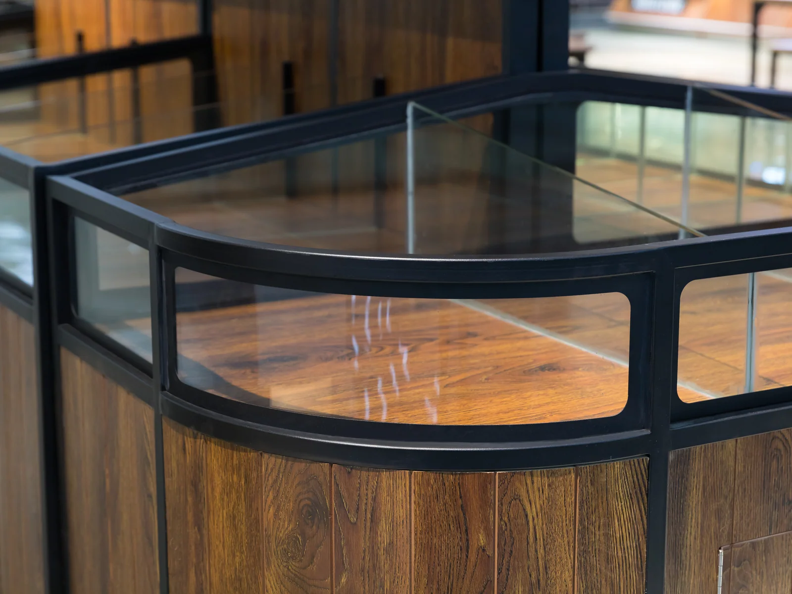 Glazed top bulk island photographed along its length, showing both sections and the walk-through