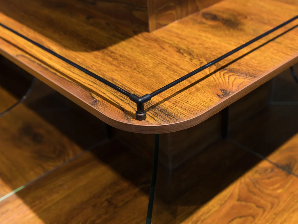 Close-up of the timber canopy top with black rails running along it