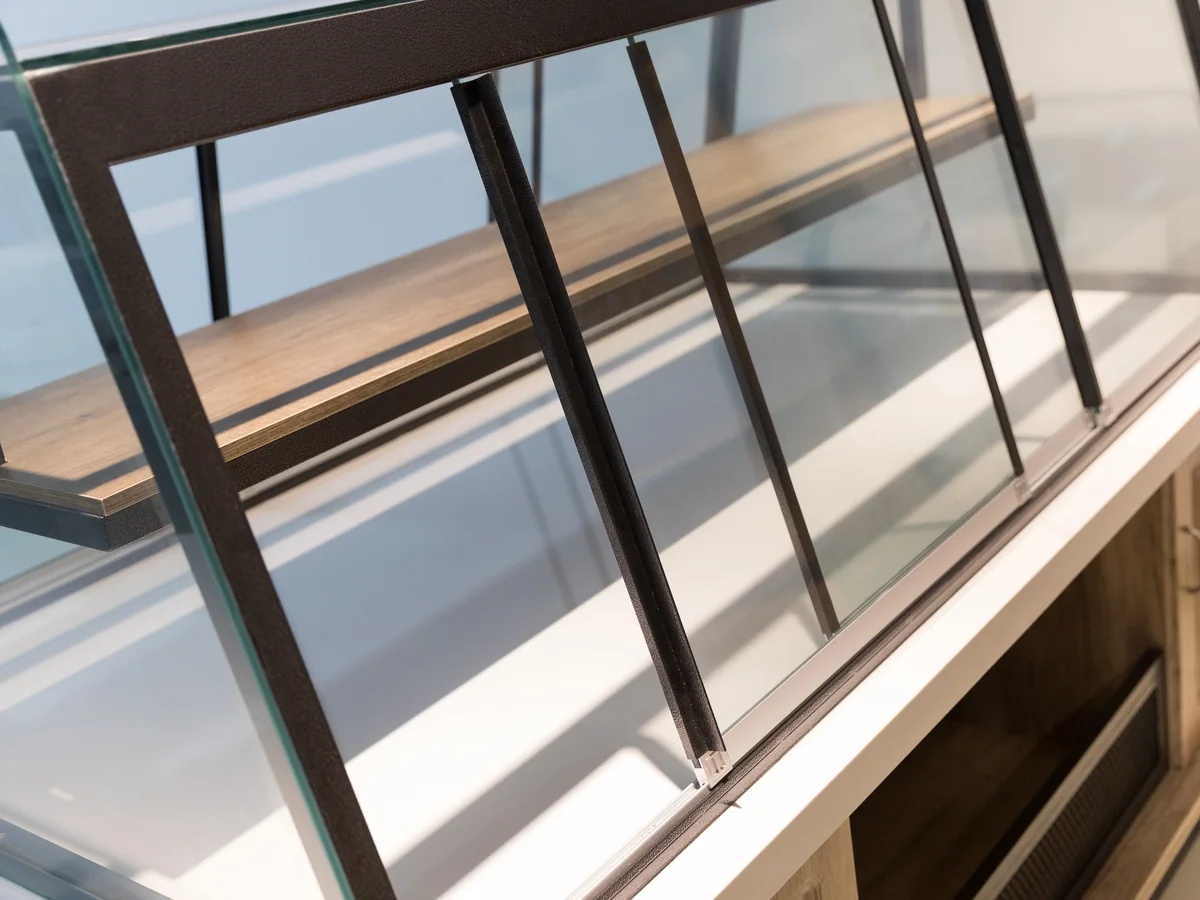 Close-up of a tiered shelf inside the counter
