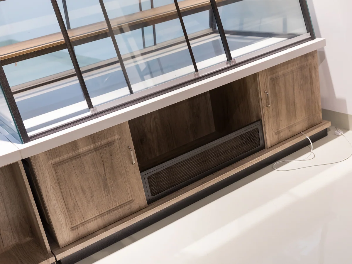 Close-up of a sliding door on the base of the counter