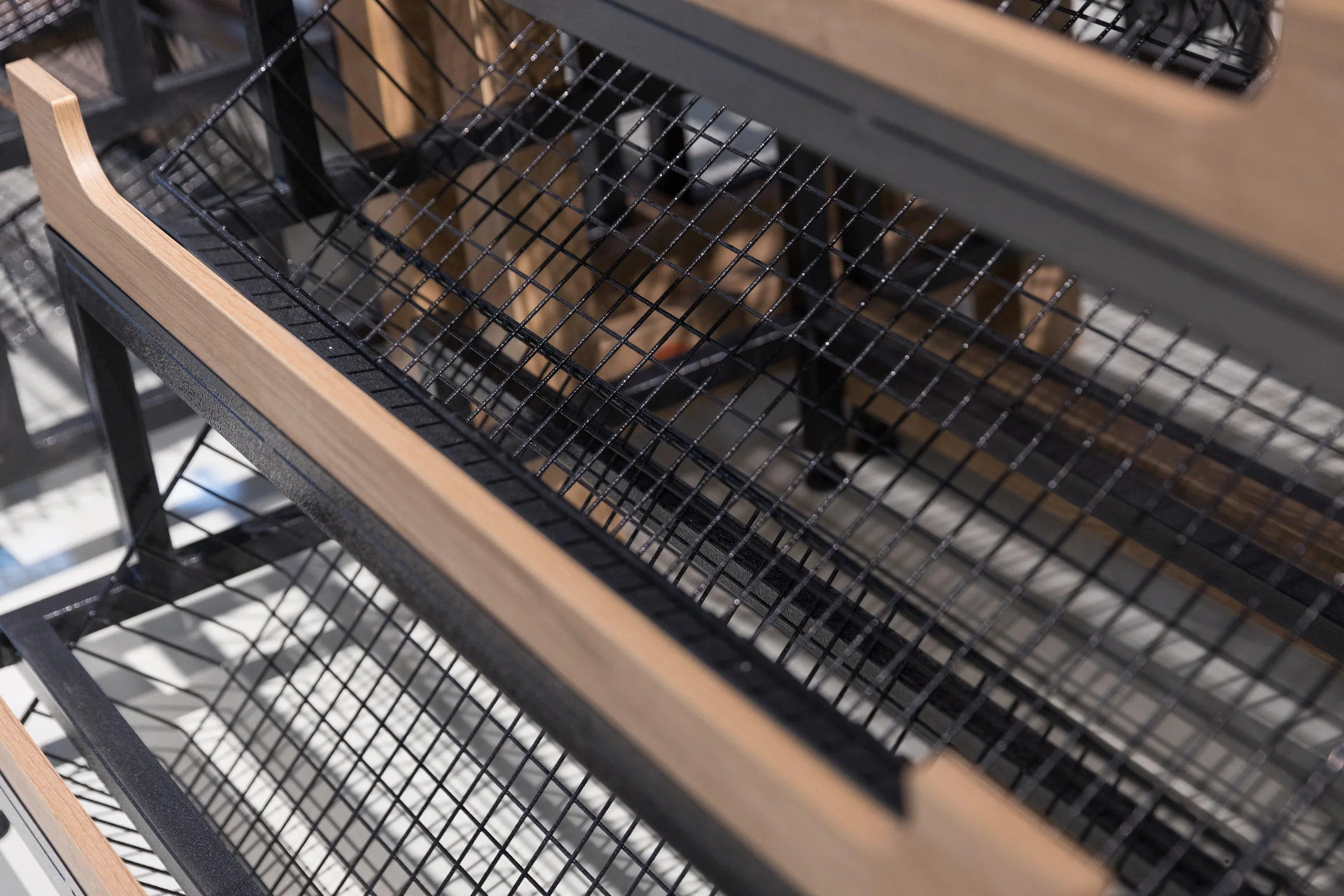 Keshun bread rack with tray shelves sized to the bake tray and sign headers on posts