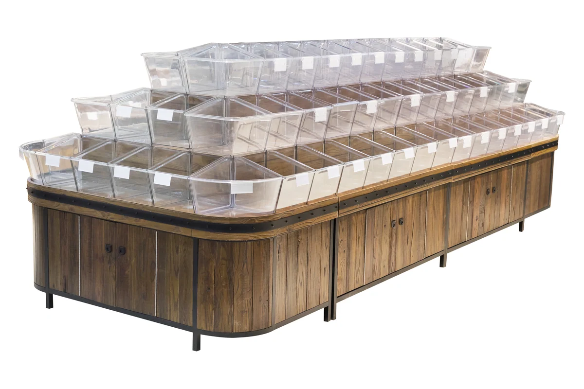 Supermarket bulk food island with tiered rows of clear tilt bins on a timber body