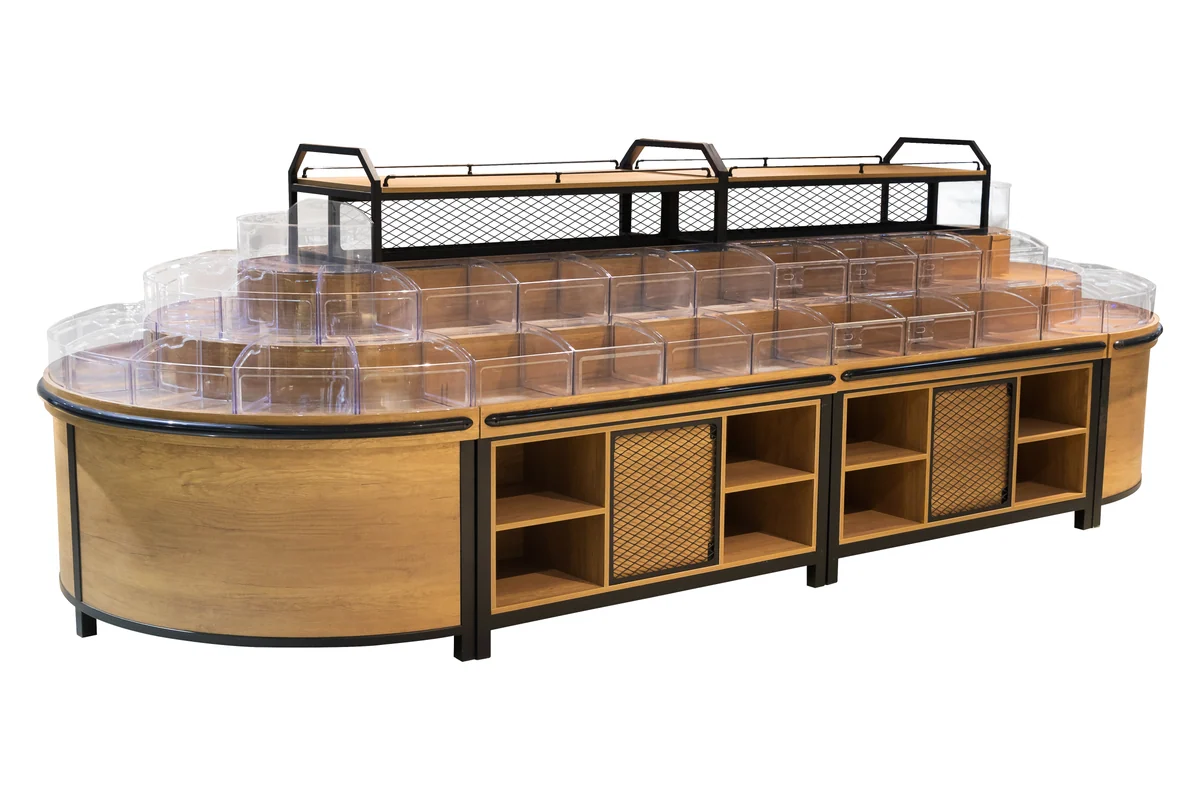 Supermarket bulk food island with a curved end, clear tilt bins and open base cubbies