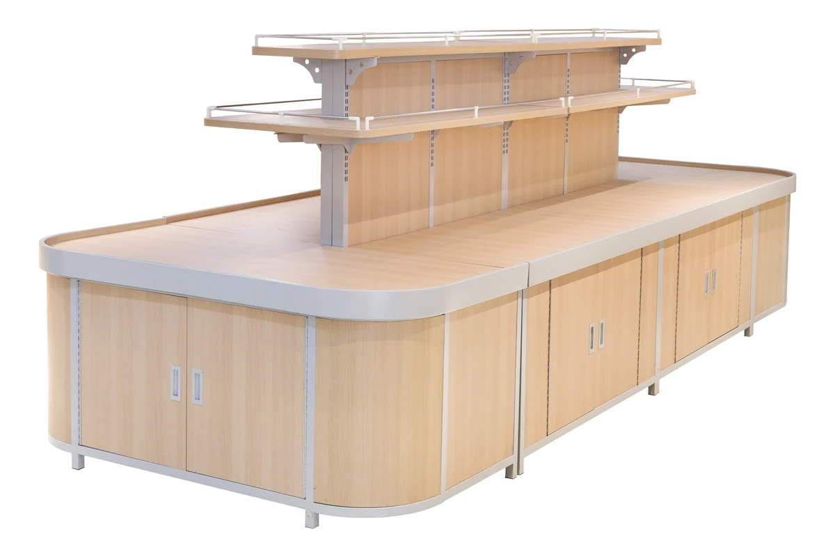 Light timber supermarket dry goods island with a pale worktop and a single upper shelf