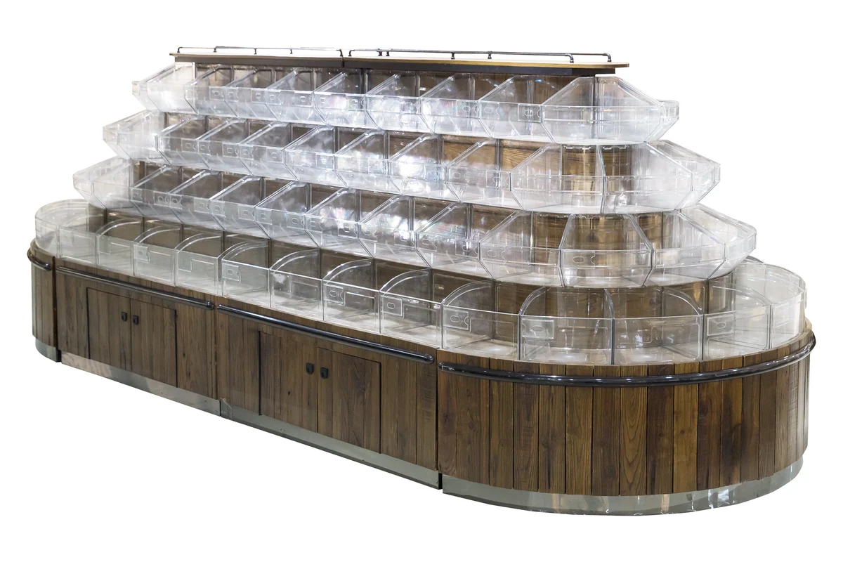 Long curved supermarket bulk food run with deep tiered clear bins on a timber body