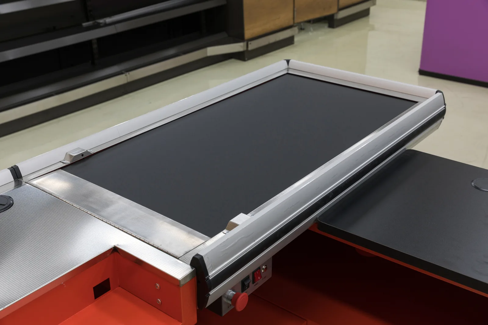 Conveyor belt deck and aluminium side rails on a Keshun supermarket checkout counter