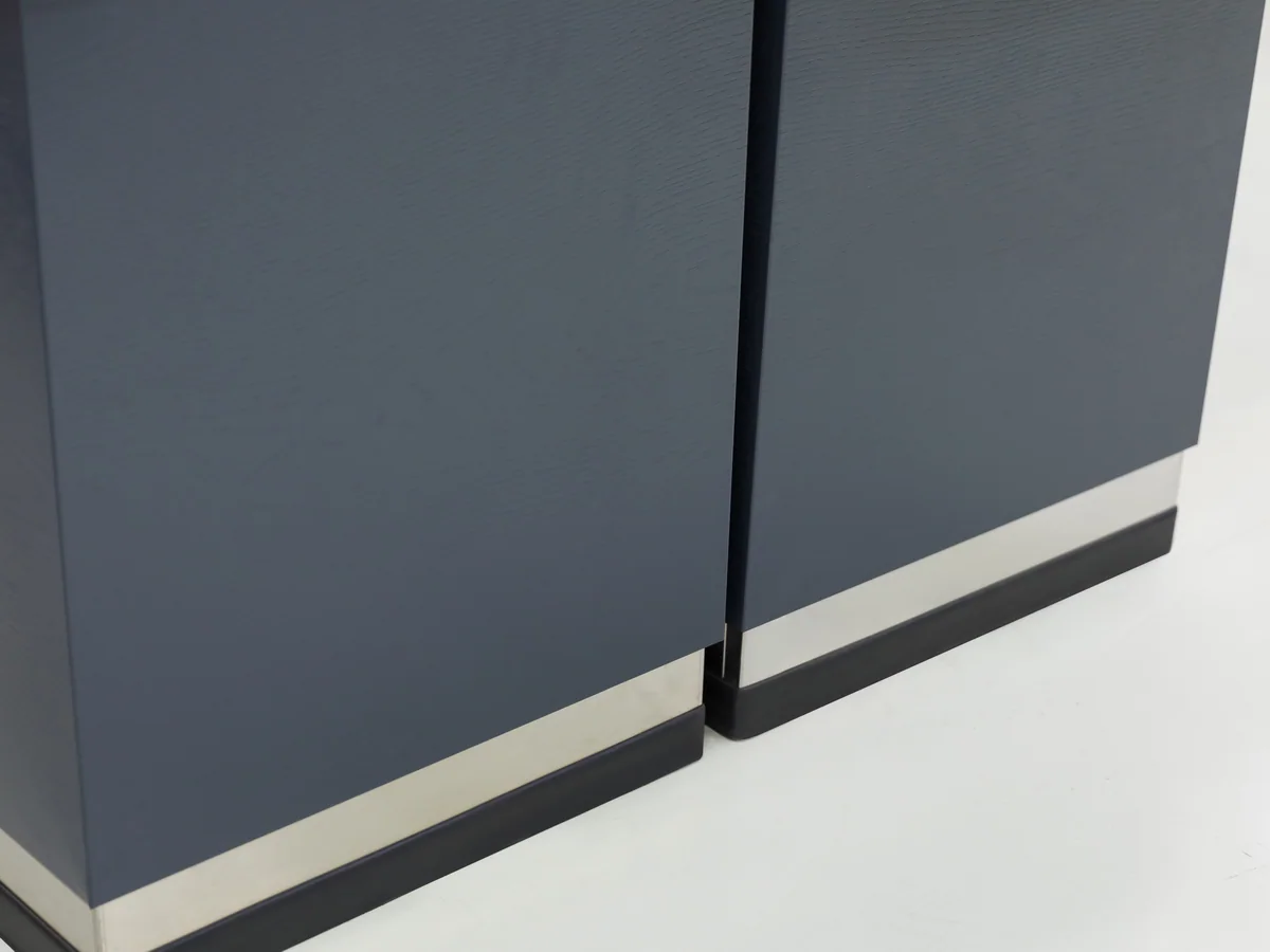 Close-up of the raised rim around the pressed stainless worktop