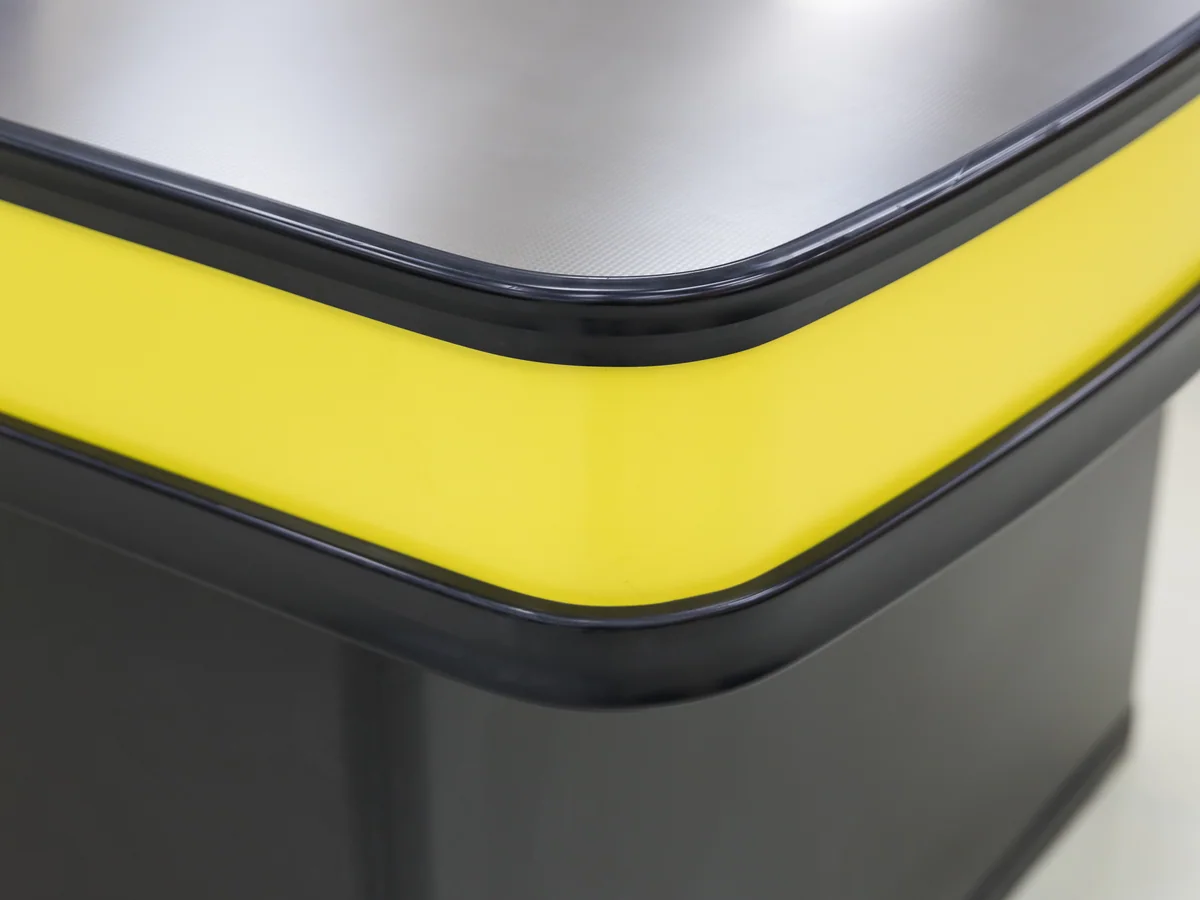 Close-up of the bright top rail wrapping the edge of the counter