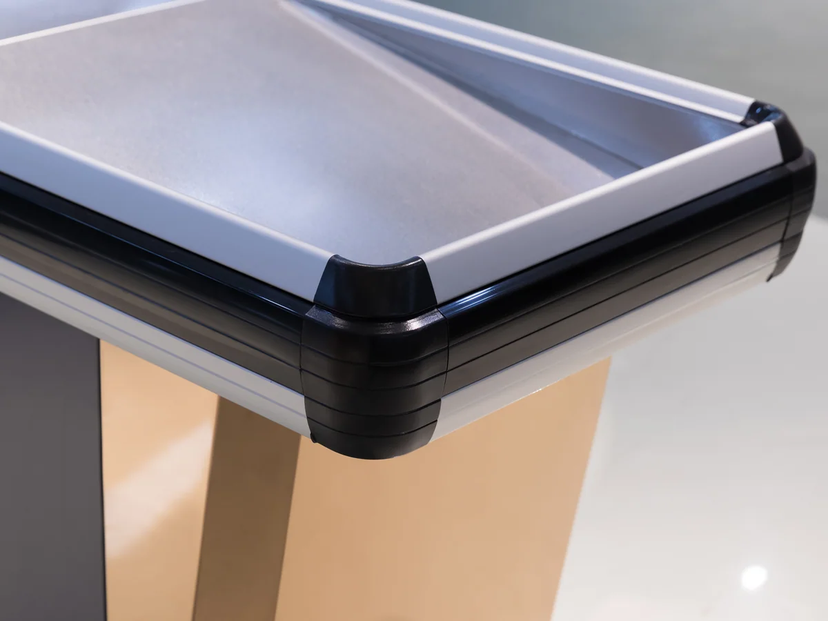 Close-up of the pressed stainless worktop running through the corner