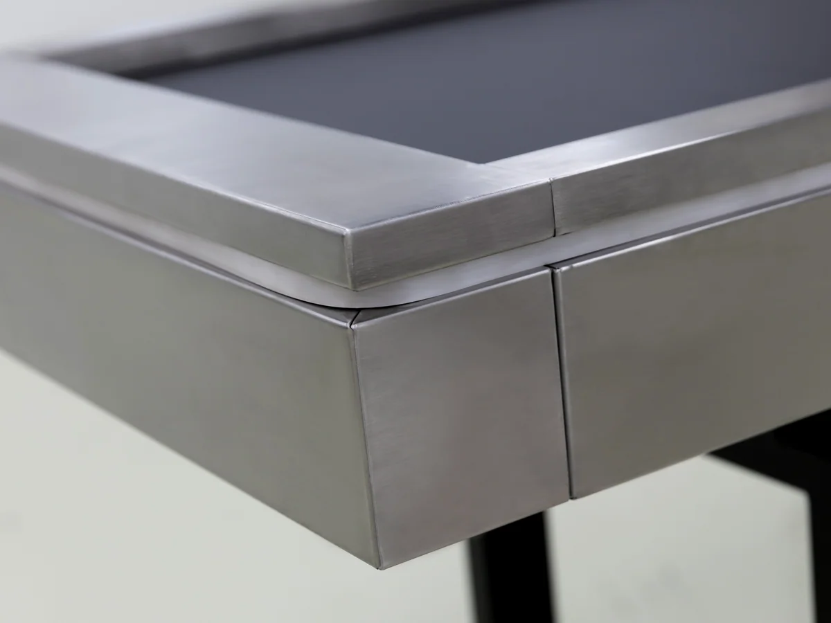 Close-up of the separate till cabinet standing beside the frame