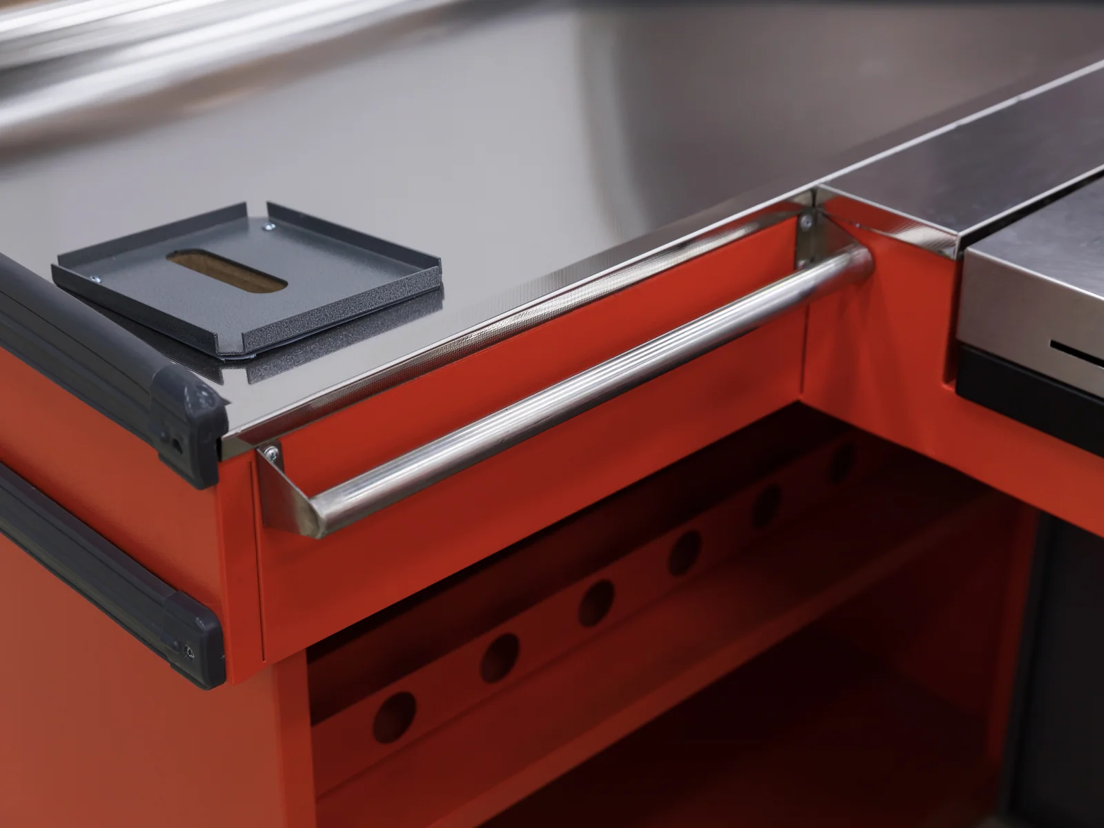 Twin wing checkout counter photographed with the cashier stool in position