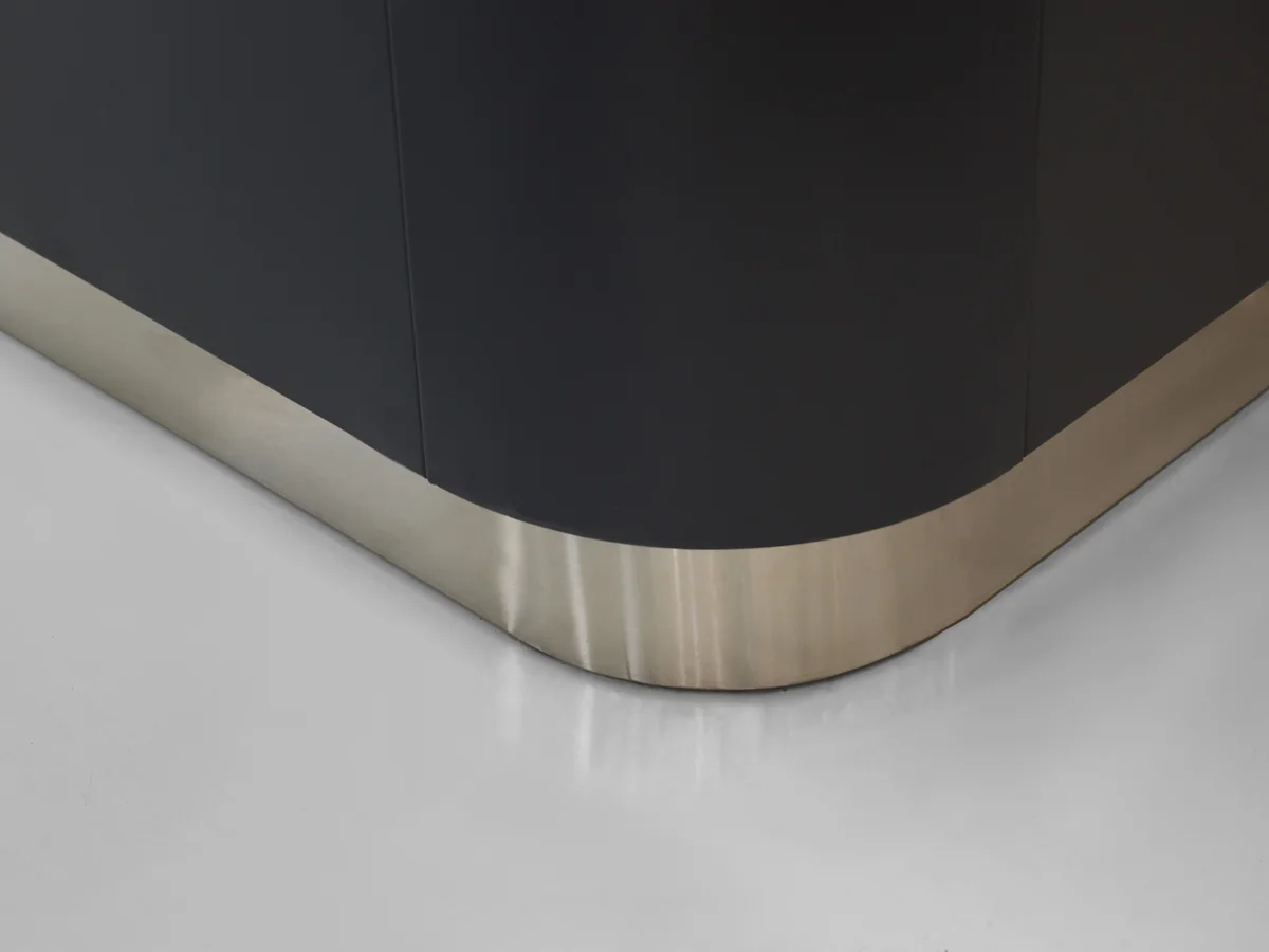 Close-up of the tan timber panel set between charcoal body panels