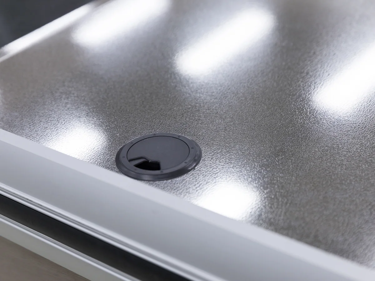 Close-up of one of the two pressed stainless tops on the twin position counter