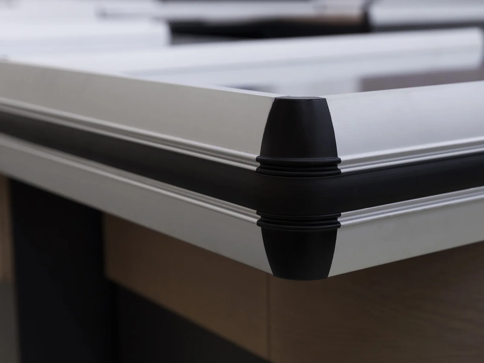 Twin position cashier counter photographed from the front, showing both stainless tops