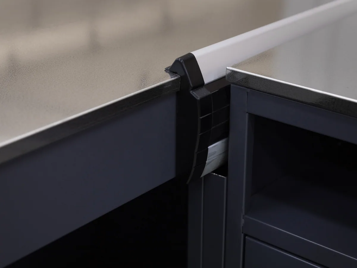Aluminium border and moulded corner cap on a two-tone Keshun cashier counter
