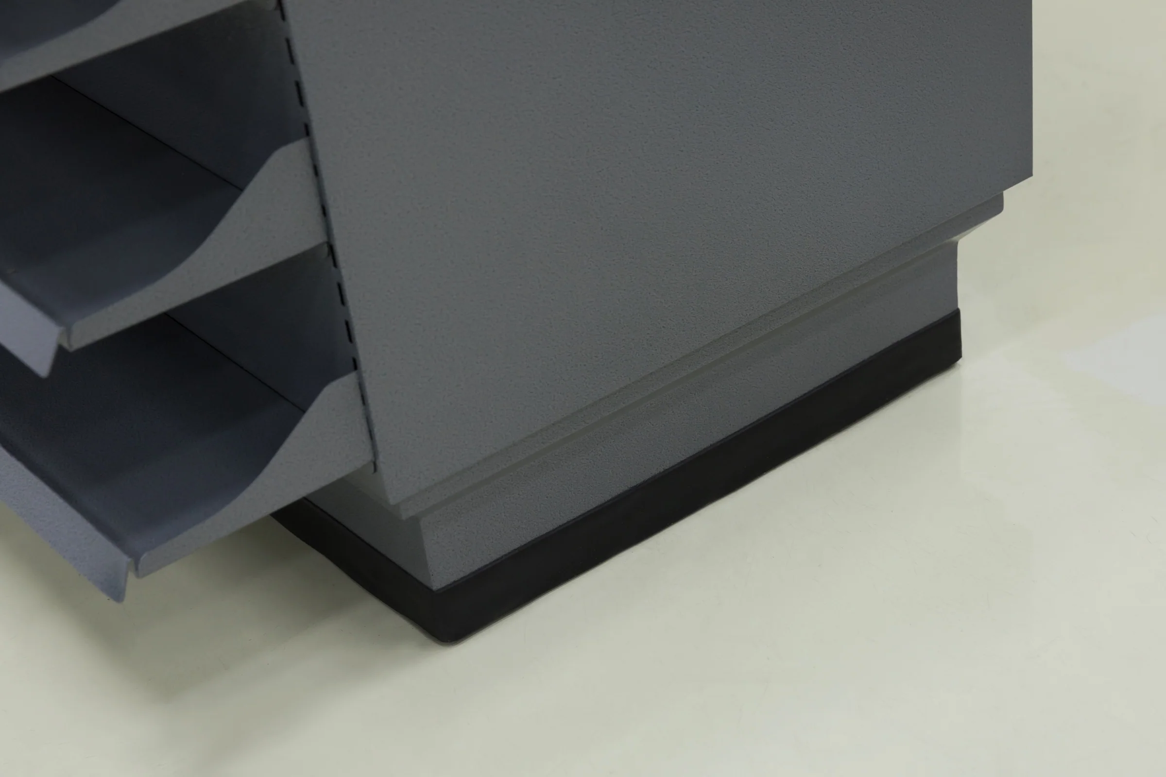 Keshun checkout counter with four angled tiered display shelves down the queue side