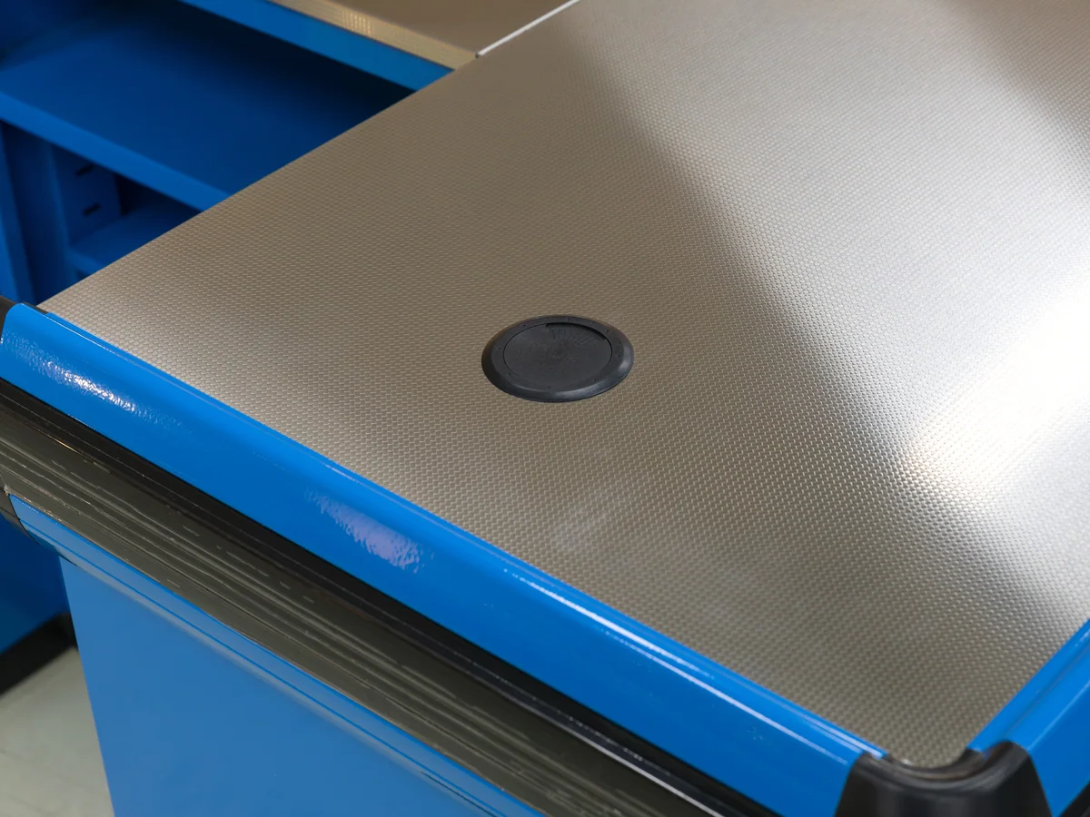 Close-up of the pressed stainless worktop against the blue body