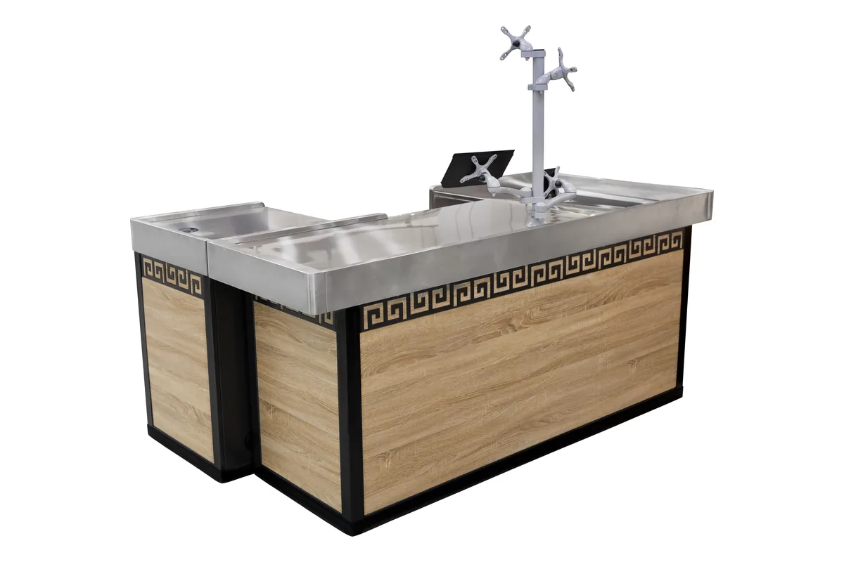 Wood checkout counter with a Greek key patterned band under a polished stainless steel top board