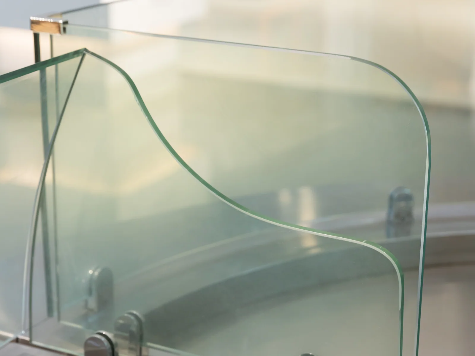 Curved serve over counter photographed from the front showing the glass screen and wells