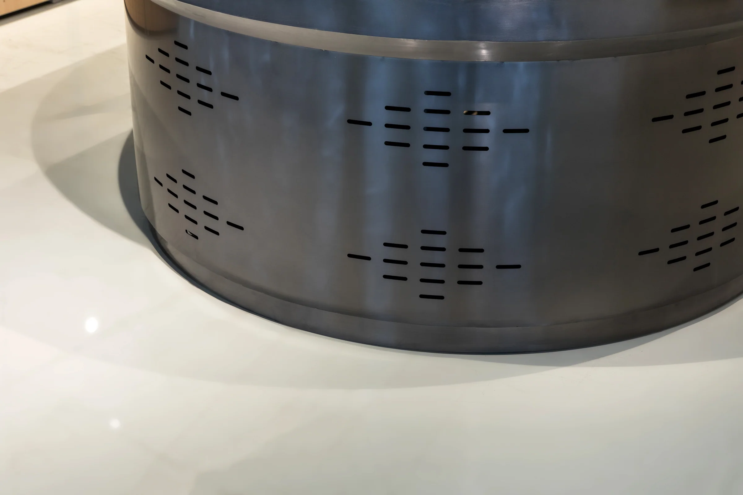 Keshun all-stainless produce island with divided wells, a round end bowl and louvred base panels