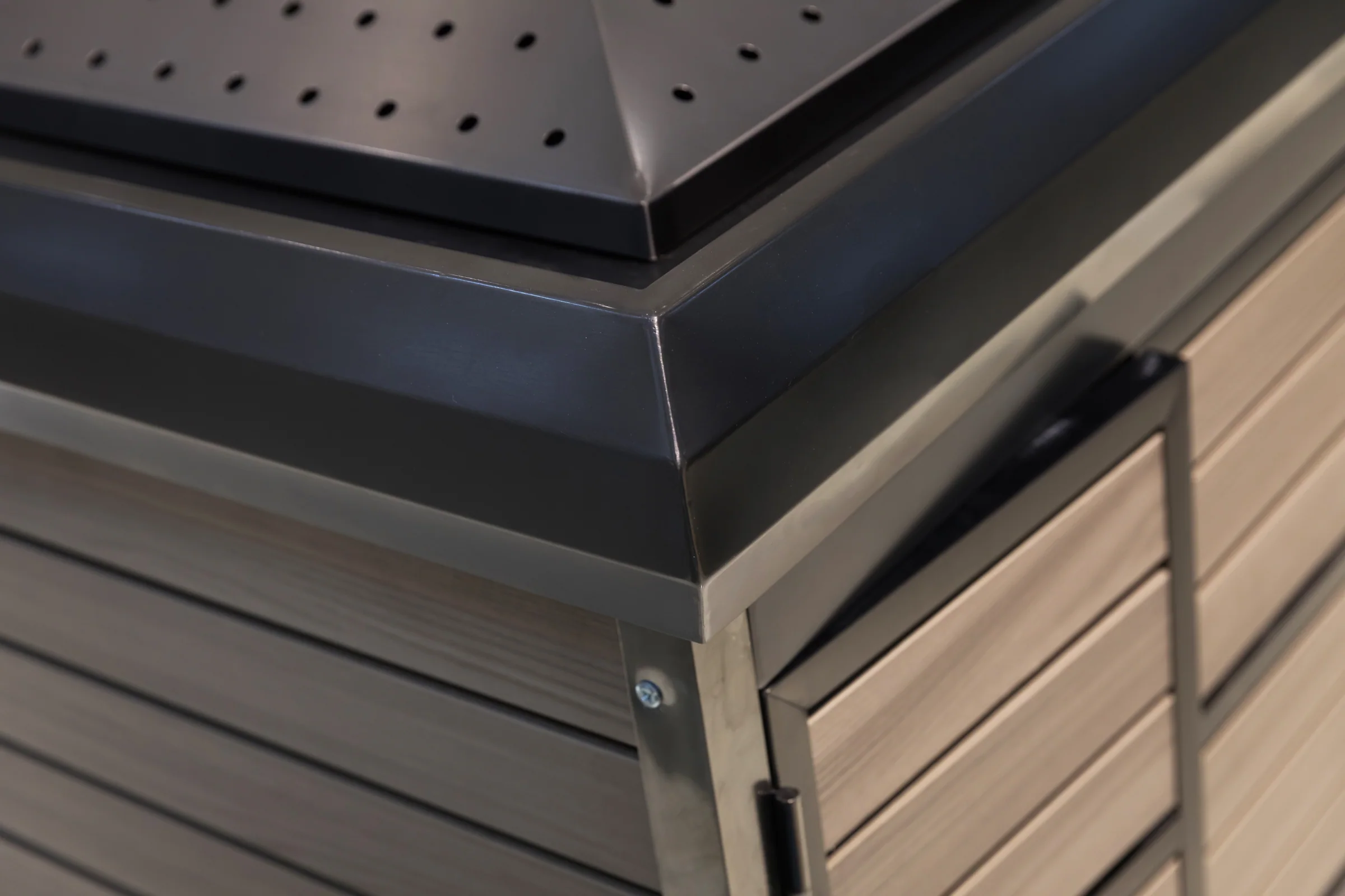 Keshun four sided produce island with a perforated pitched canopy over crate-slat timber panels