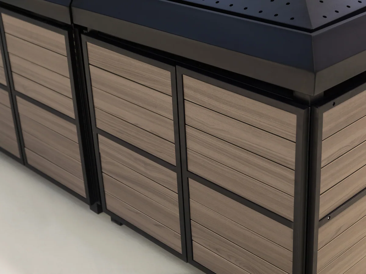 Close-up of the dark slatted timber panels on the island body