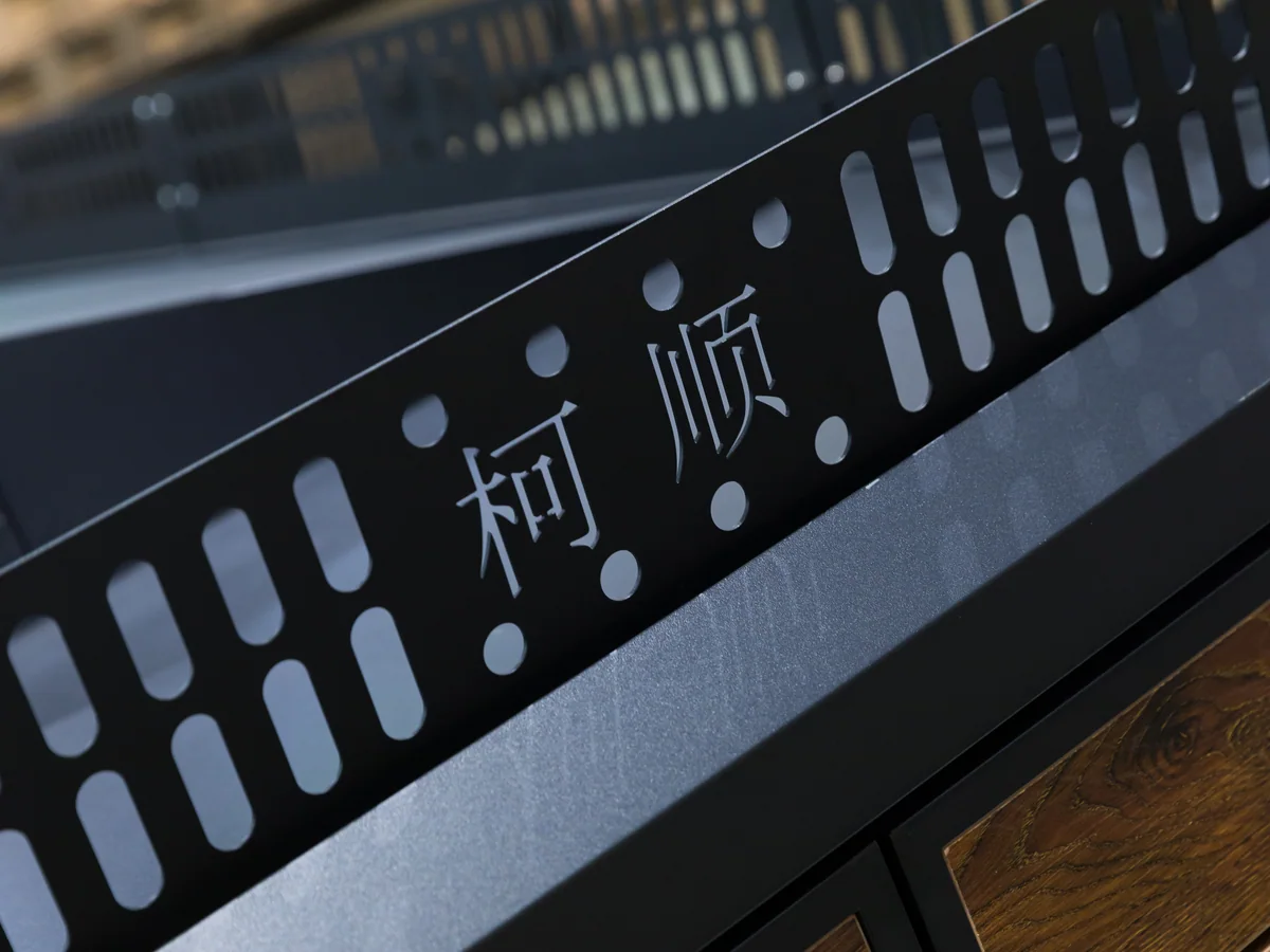 Close-up of the dark timber body panel below the crate line
