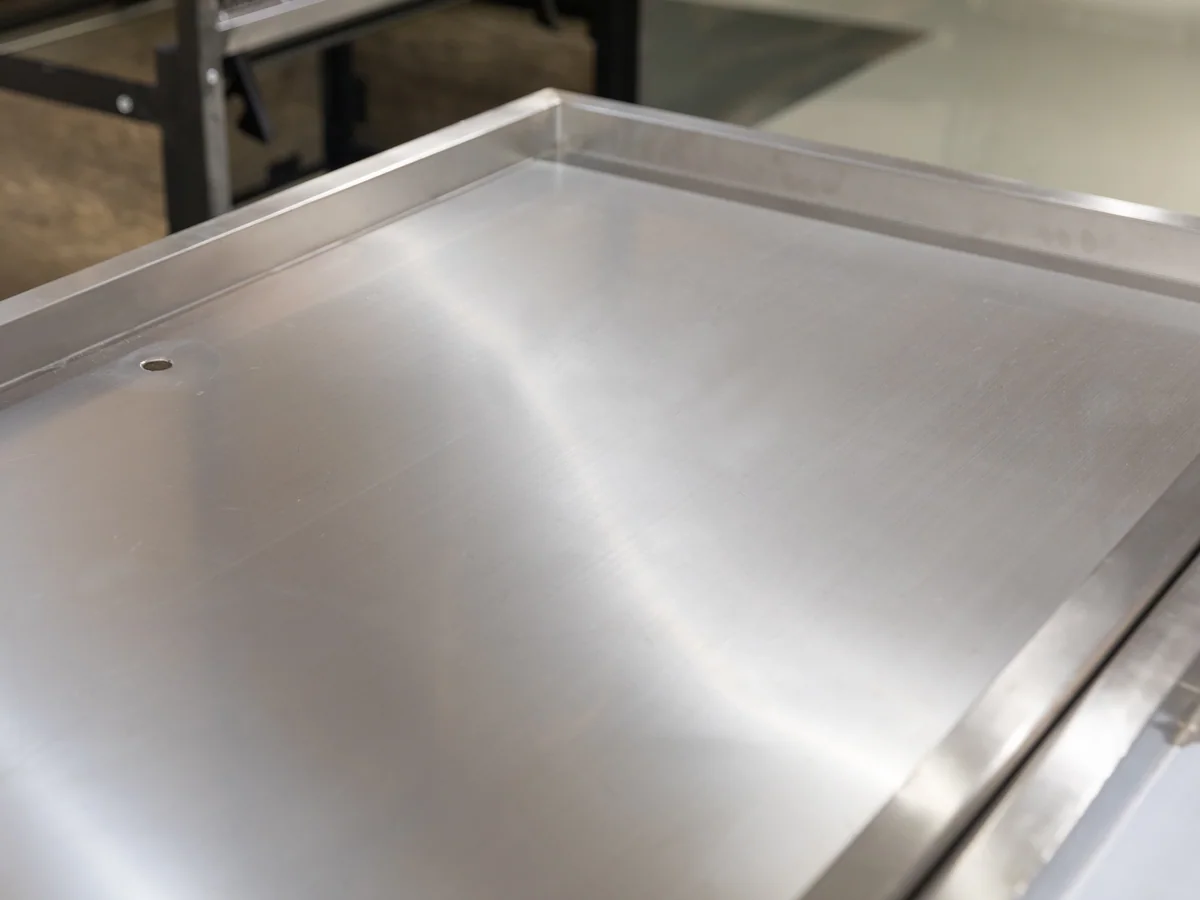 Close-up of the diamond perforated base panel