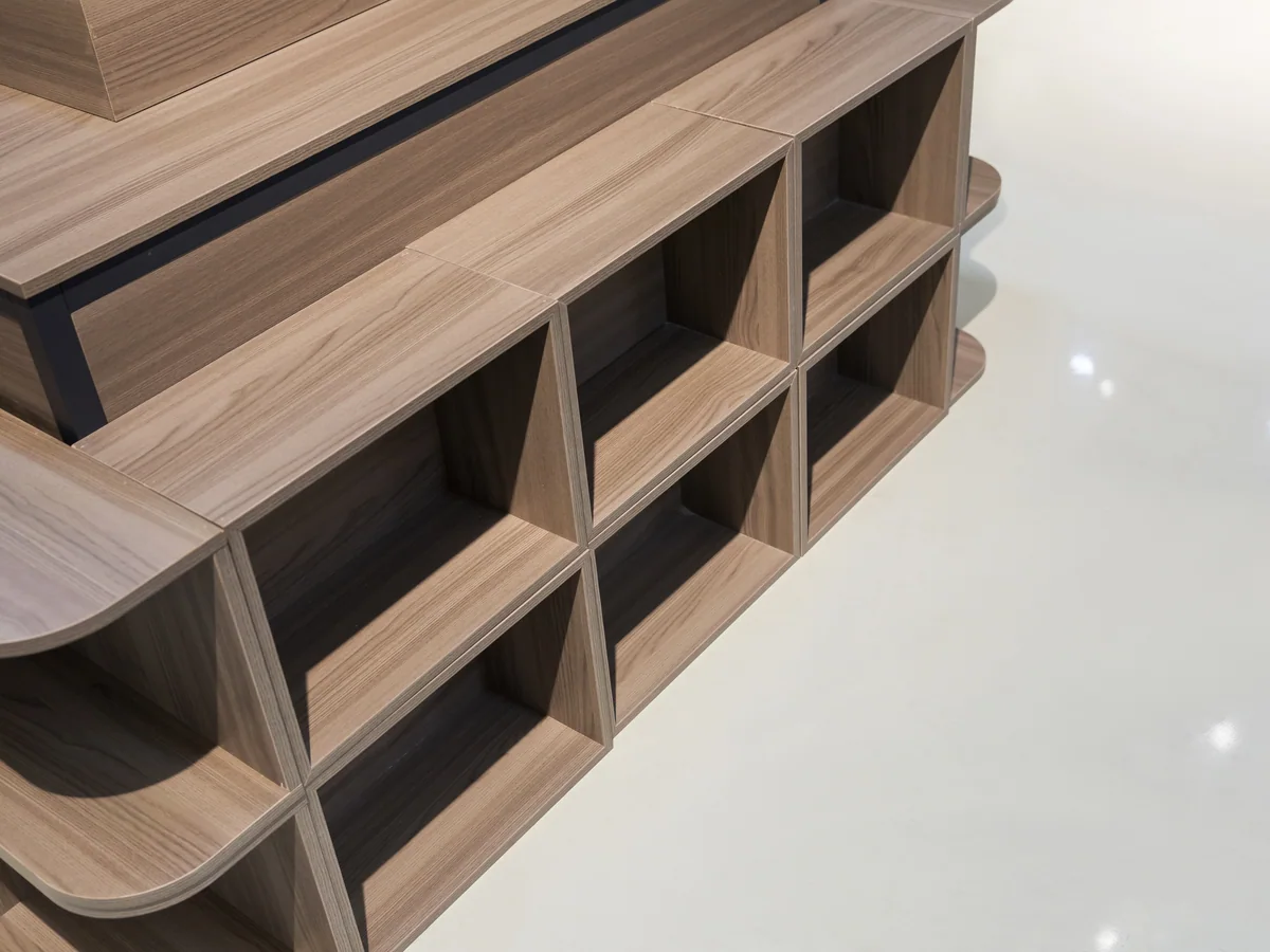 Close-up of a cubby compartment in the base of the stand