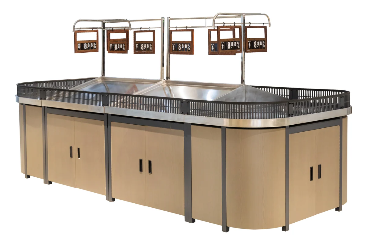 Supermarket produce island with tiered stainless steel deck and four overhead sign frames